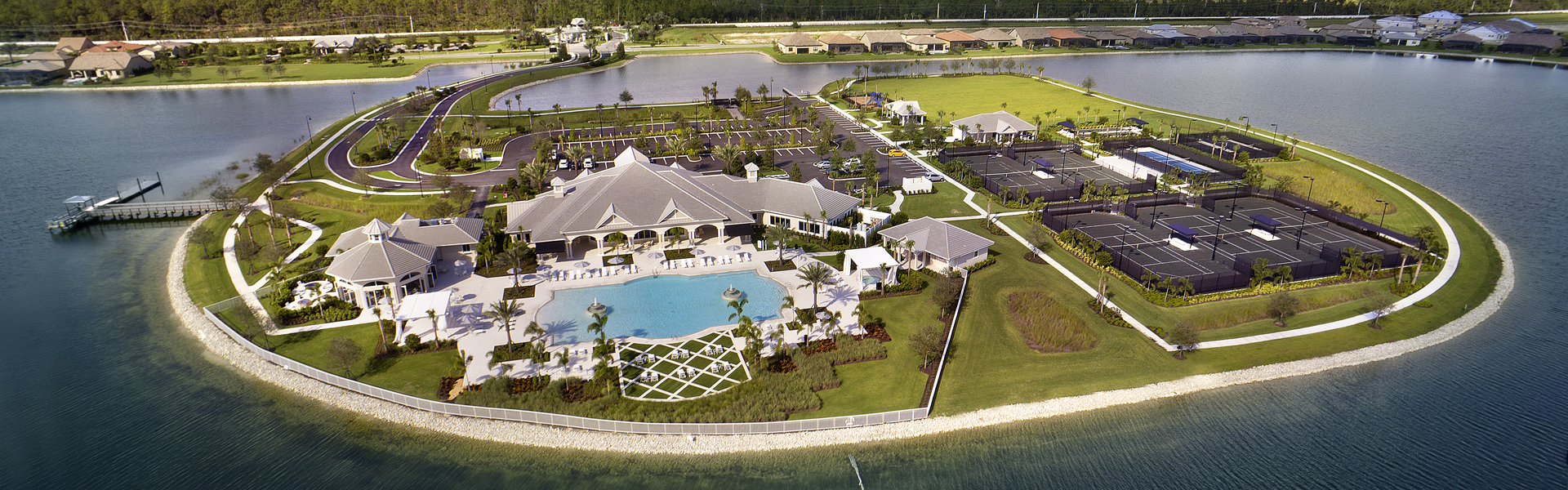 Corkscrew Shores amenity island aerial view — surrounded by lake on three sides